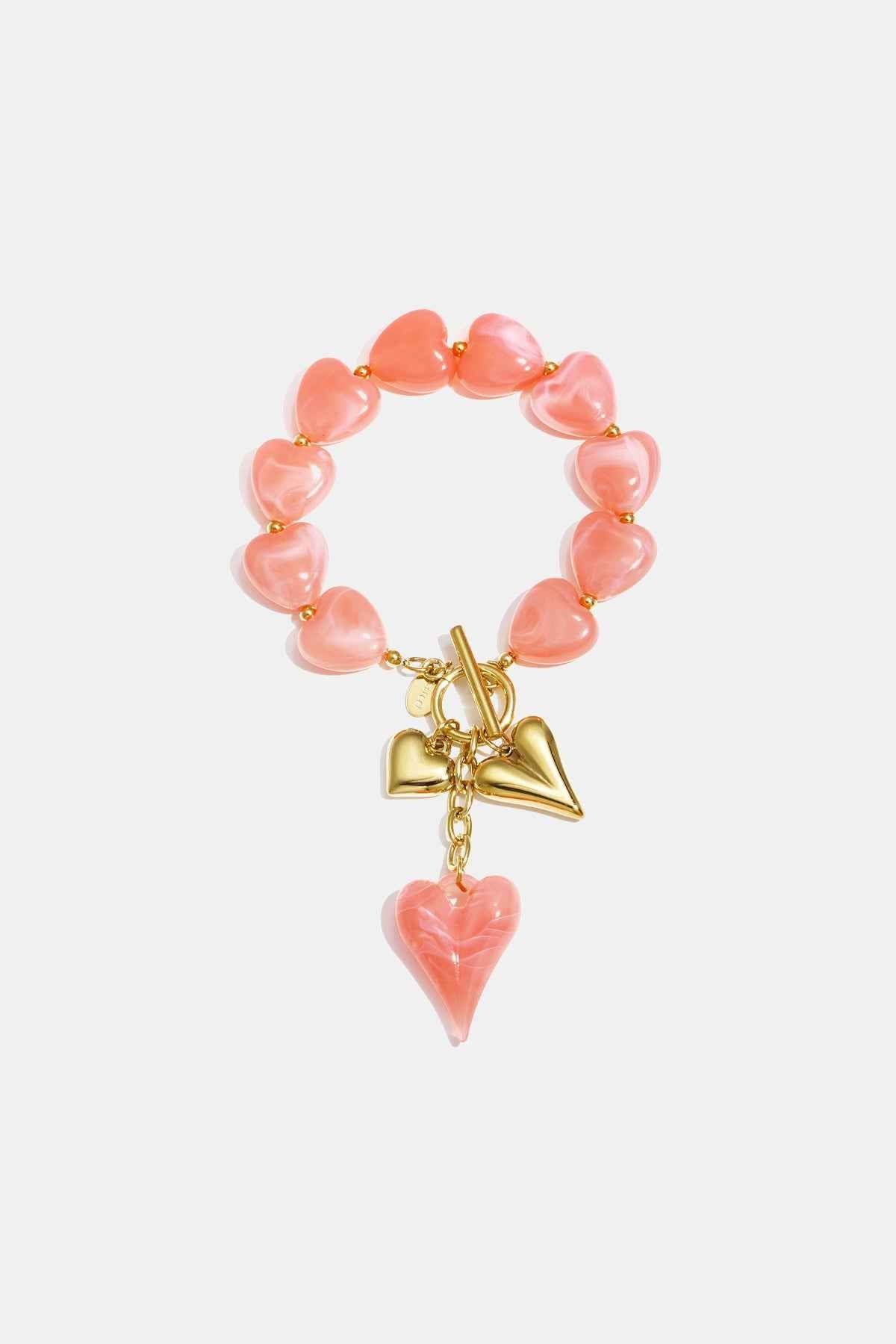 Beaded bracelet with hanging heart charms