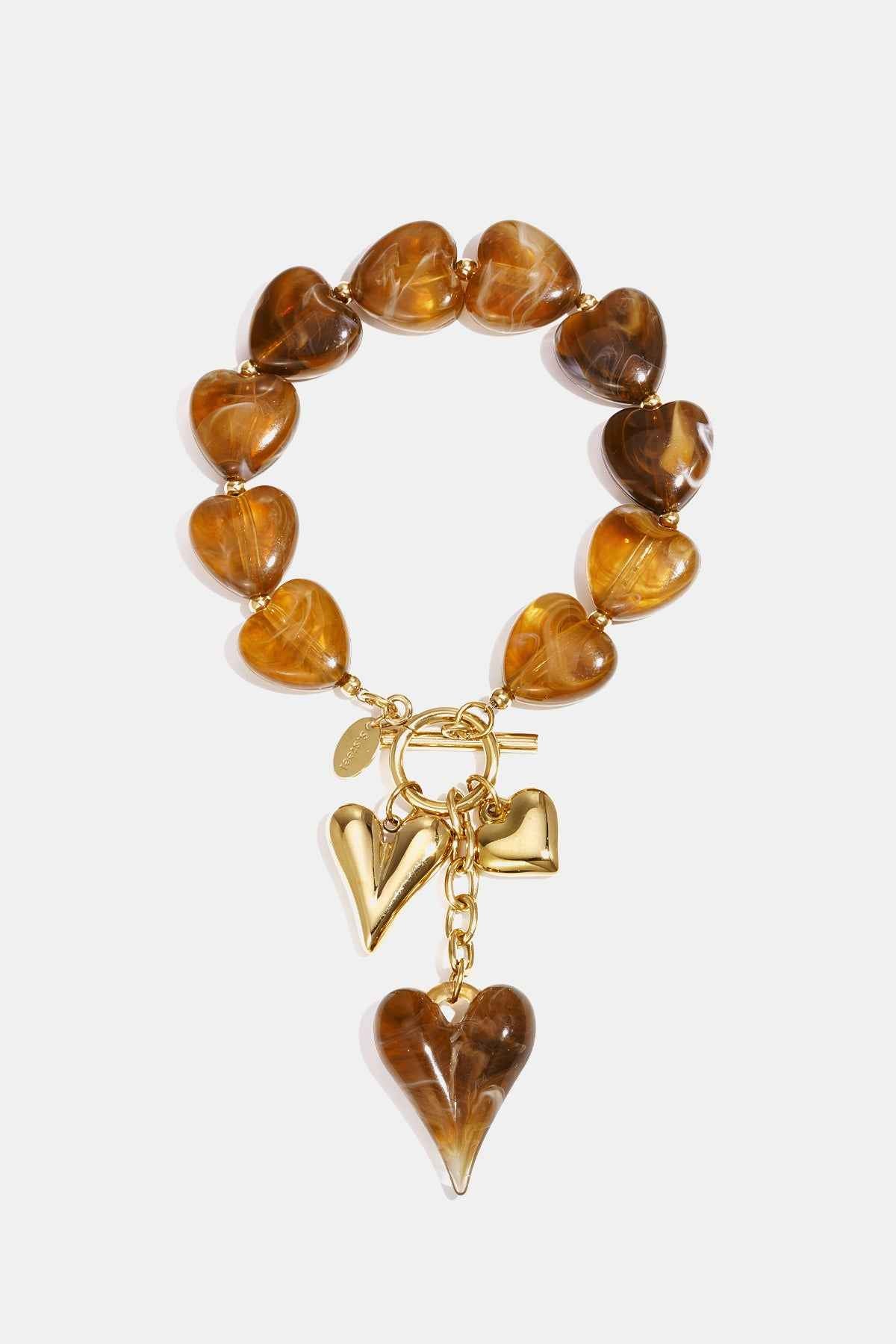 Beaded bracelet with hanging heart charms