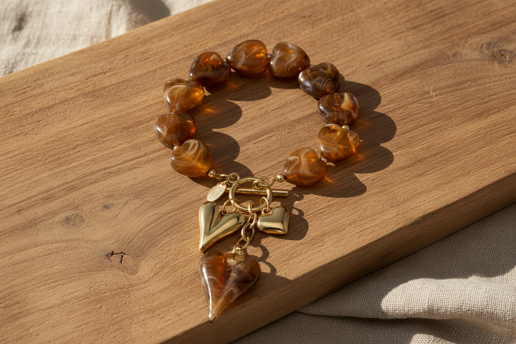 Beaded bracelet with hanging heart charms